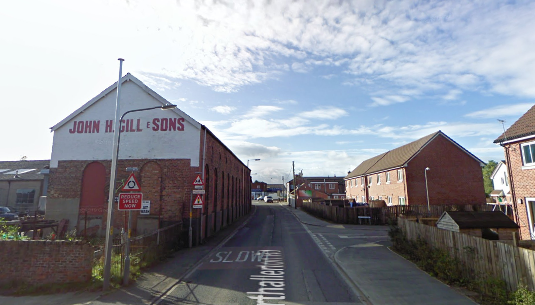 A Google Maps image of Northallerton Road, Leeming Bar, taken in November 2009. With the John H. Gill & Sons building still up but surrounded by new houses.